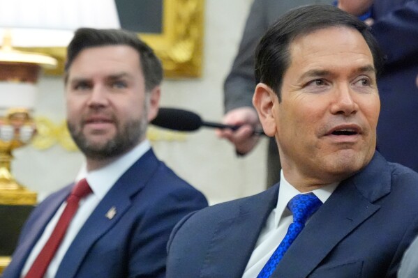 Vice President JD Vance, left, and Secretary of State Marco Rubio attend a meeting in the Oval Office at the White House, March 3, 2026, in Washington. (AP Photo/Mark Schiefelbein, file)