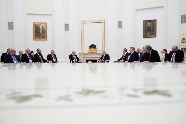 Russian President Vladimir Putin, center right, and Armenian Prime Minister Nikol Pashinyan, center left, hold talks at the Kremlin in Moscow, Wednesday, April 1, 2026. (AP Photo/Pavel Bednyakov, Pool)