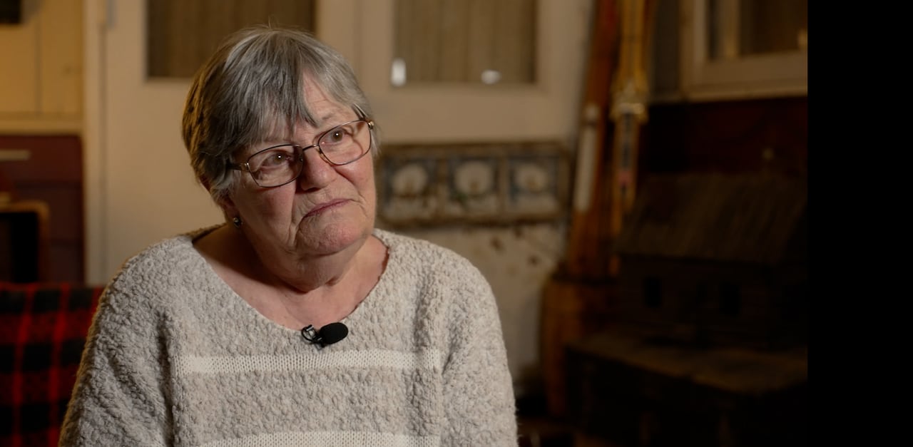 WOman sitting in chair with short hair
