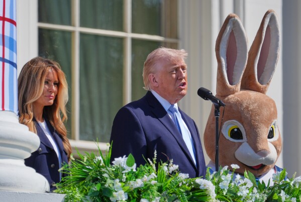 President Donald Trump and first lady Melania Trump participate in the White House Easter Egg Roll on the South Lawn of the White House, Monday, April 6, 2026, in Washington. (AP Photo/Mark Schiefelbein)