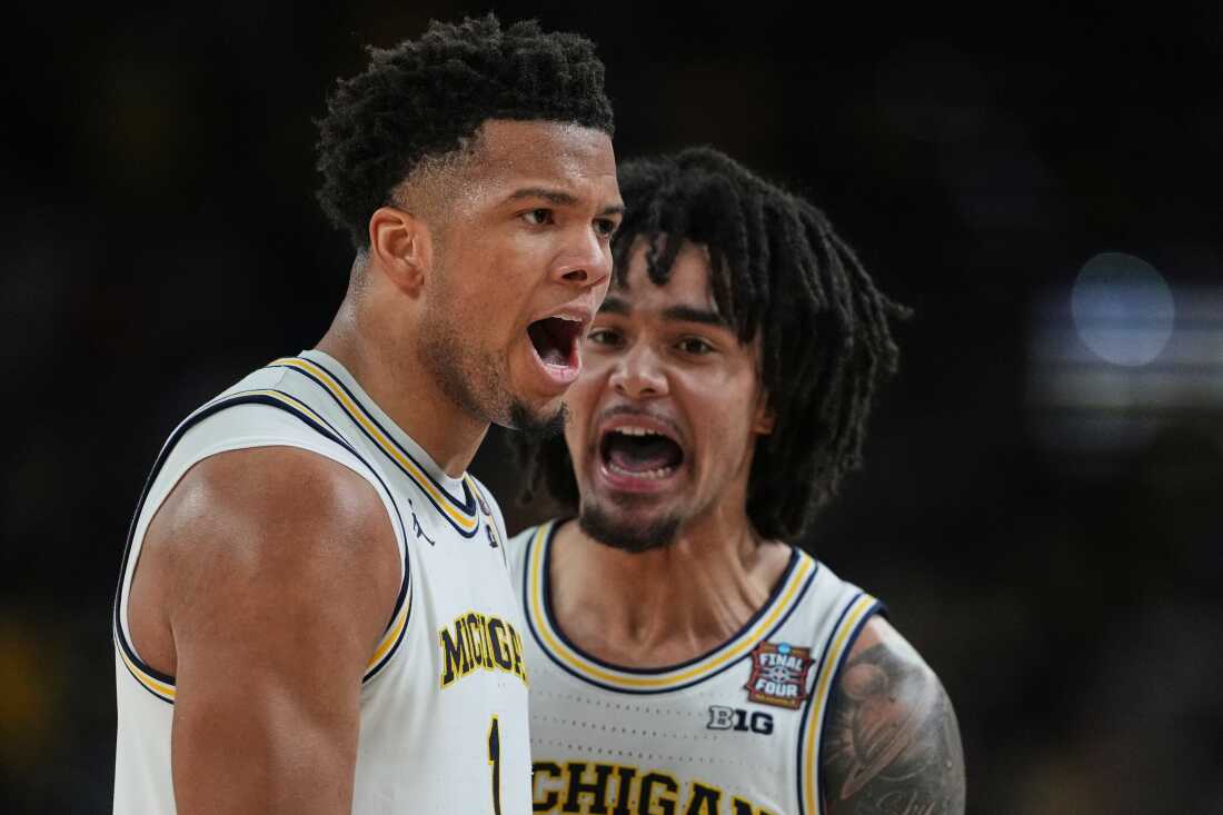 Michigan's Trey McKenney, left, and Elliot Cadeau celebrate during the second half of the NCAA college basketball tournament national championship game against UConn at the Final Four, Monday, April 6, 2026, in Indianapolis.