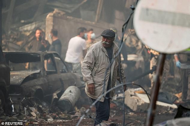 A man walks at the site of an Israeli strike, in Al-Mazraa in Beirut, Lebanon, April 8, 2026. REUTERS/Yara Nardi     TPX IMAGES OF THE DAY