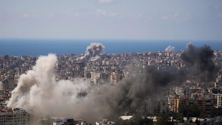 Smoke rises following several Israeli airstrikes in Beirut, Lebanon, Wednesday,...