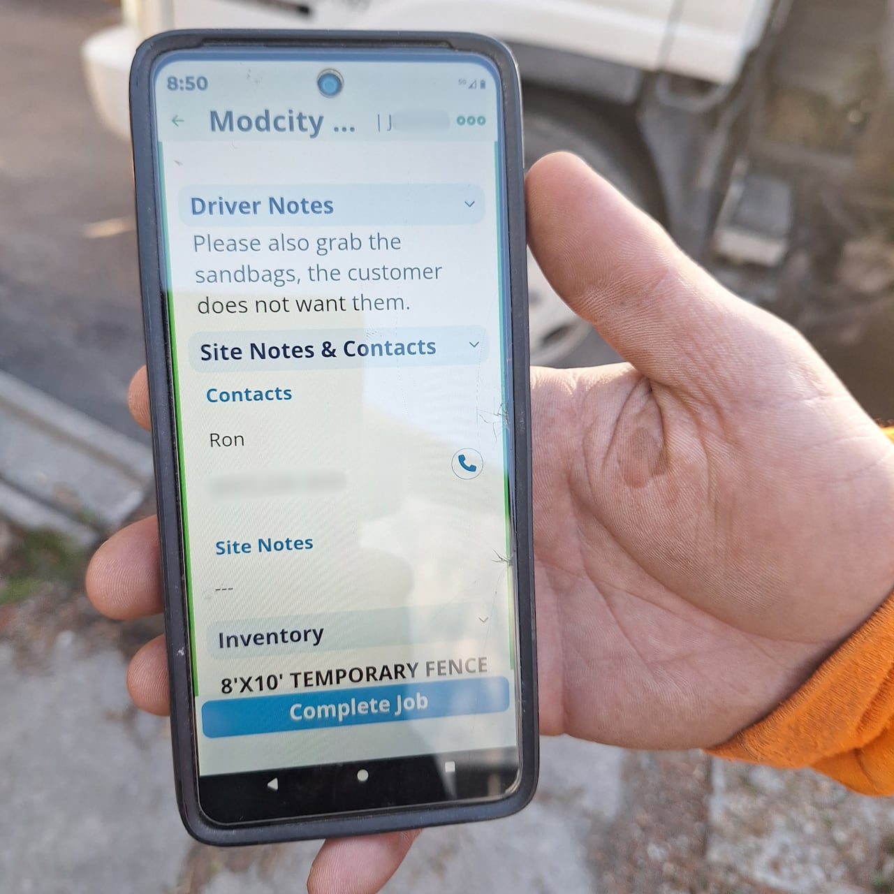 This screenshot, provided to a neighbour by a worker for the fence company that was on site while the trees were being removed, appears to confirm Modcity as the company that rented the construction fencing around the site.