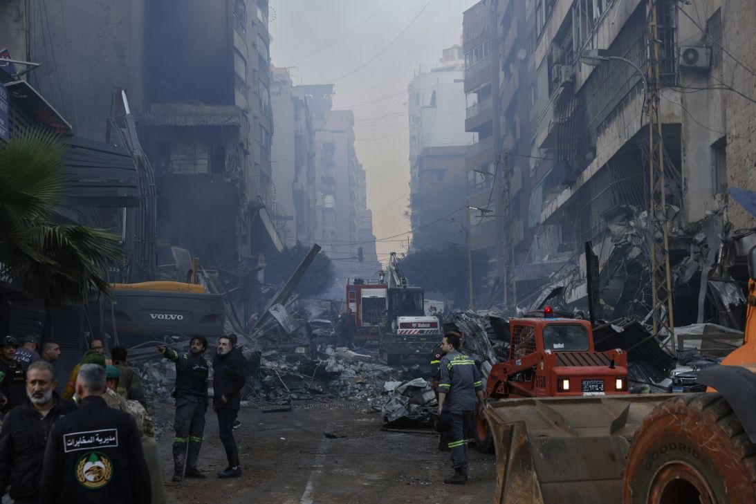 Rescue workers search for people after an Israeli attack hit a residential building in the Corniche al Mazraa neighborhood on Wednesday in Beirut, Lebanon.