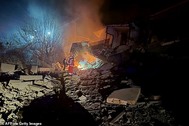 First responders look for survivors at the site of an Israeli airstrike that targeted the southern Lebanese village of Choukine on April 9, 2026. A Hezbollah lawmaker on April 9 reiterated his group's rejection of any direct negotiations between Lebanon and Israel, after Israeli Prime Minister Benjamin Netanyahu said he had ordered his cabinet to begin talks with Beirut. (Photo by Abbas FAKIH / AFP via Getty Images)