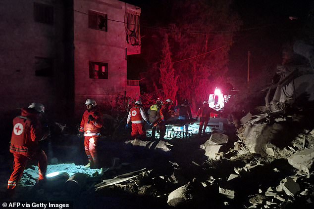 First responders look for survivors at the site of an Israeli airstrike that targeted the southern Lebanese village of Choukine on April 9, 2026. A Hezbollah lawmaker on April 9 reiterated his group's rejection of any direct negotiations between Lebanon and Israel, after Israeli Prime Minister Benjamin Netanyahu said he had ordered his cabinet to begin talks with Beirut. (Photo by Abbas FAKIH / AFP via Getty Images)