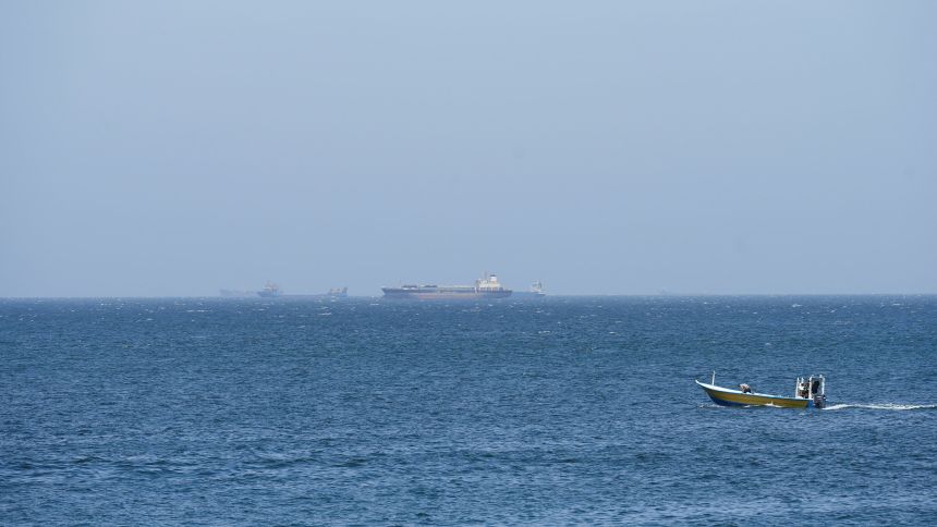 Vessels and boats are off the coast of Musandam governorate in Oman, overlooking the Strait of Hormuz, on Wednesday.