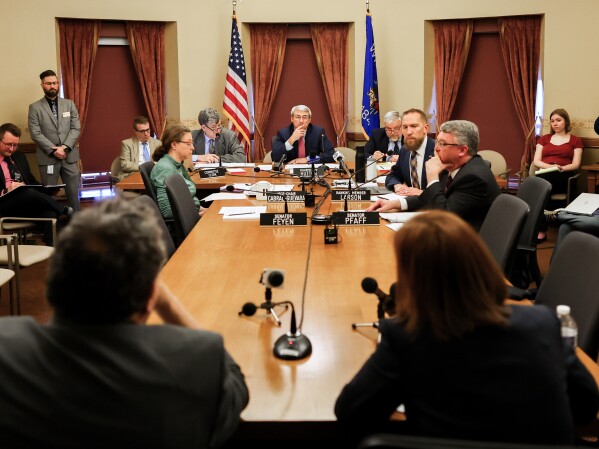UW Board of Regents President Amy Bogost and Regent Timothy Nixon, close, are questioned at a hearing with the Wisconsin State Senate Committee on Education on Thursday, April 9, 2026 at the Wisconsin State Capitol in Madison, Wis. (Owen Ziliak/Wisconsin State Journal via AP)
