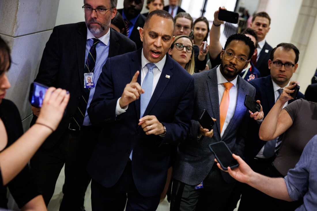 House Minority Leader Hakeem Jeffries, D-N.Y., speaks with reporters as he walks to his office on March 27, 2026. Democrats have sought to link criticism about the war in Iran with broader concerns around affordability.