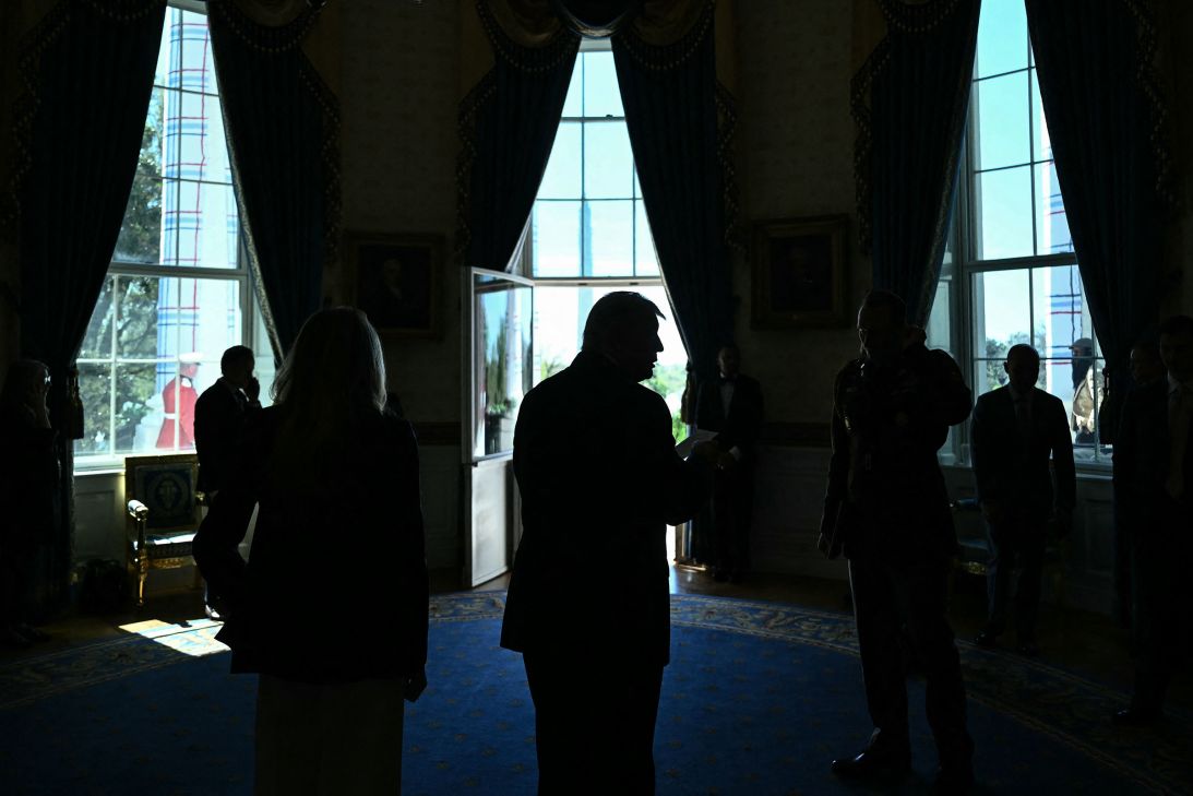 President Donald Trump stands in the Blue Room of the White House on April 6.