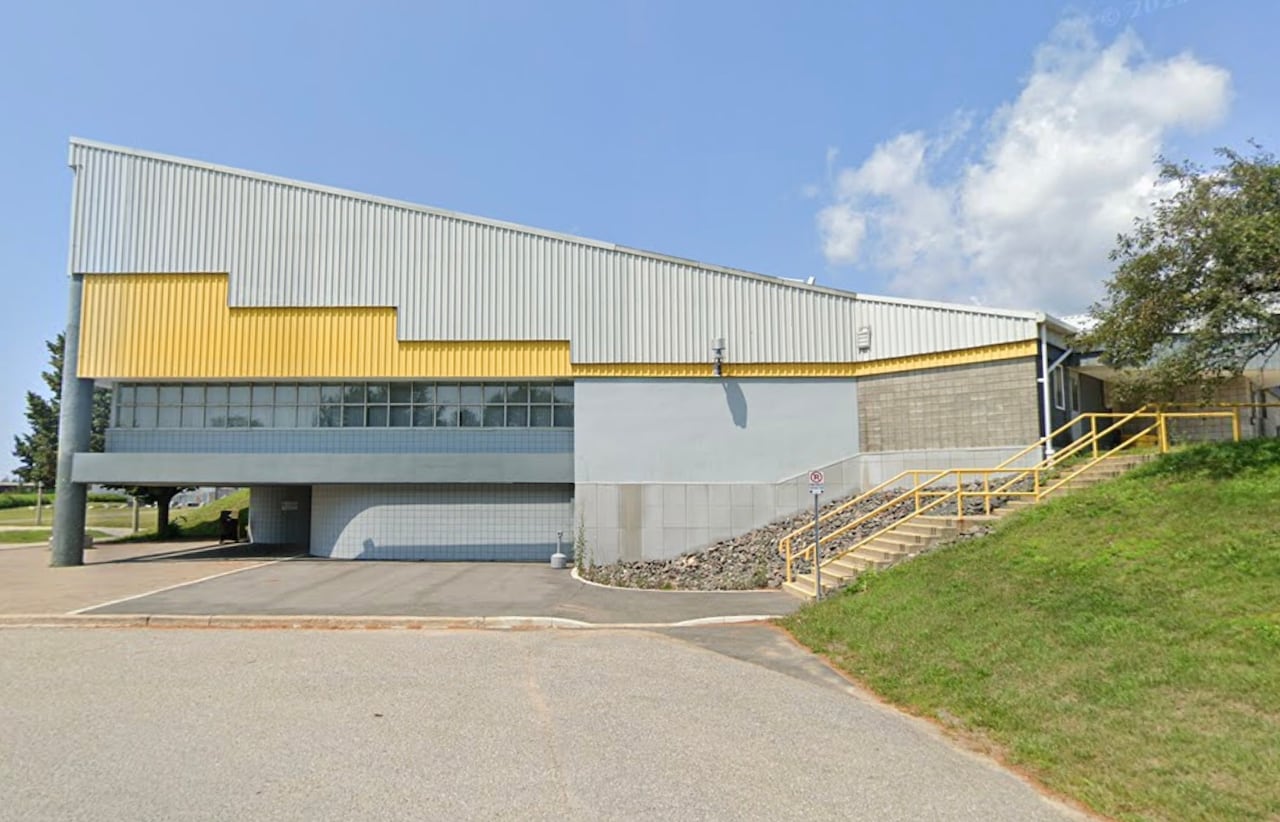 Exterior of hockey arena during sunny day.