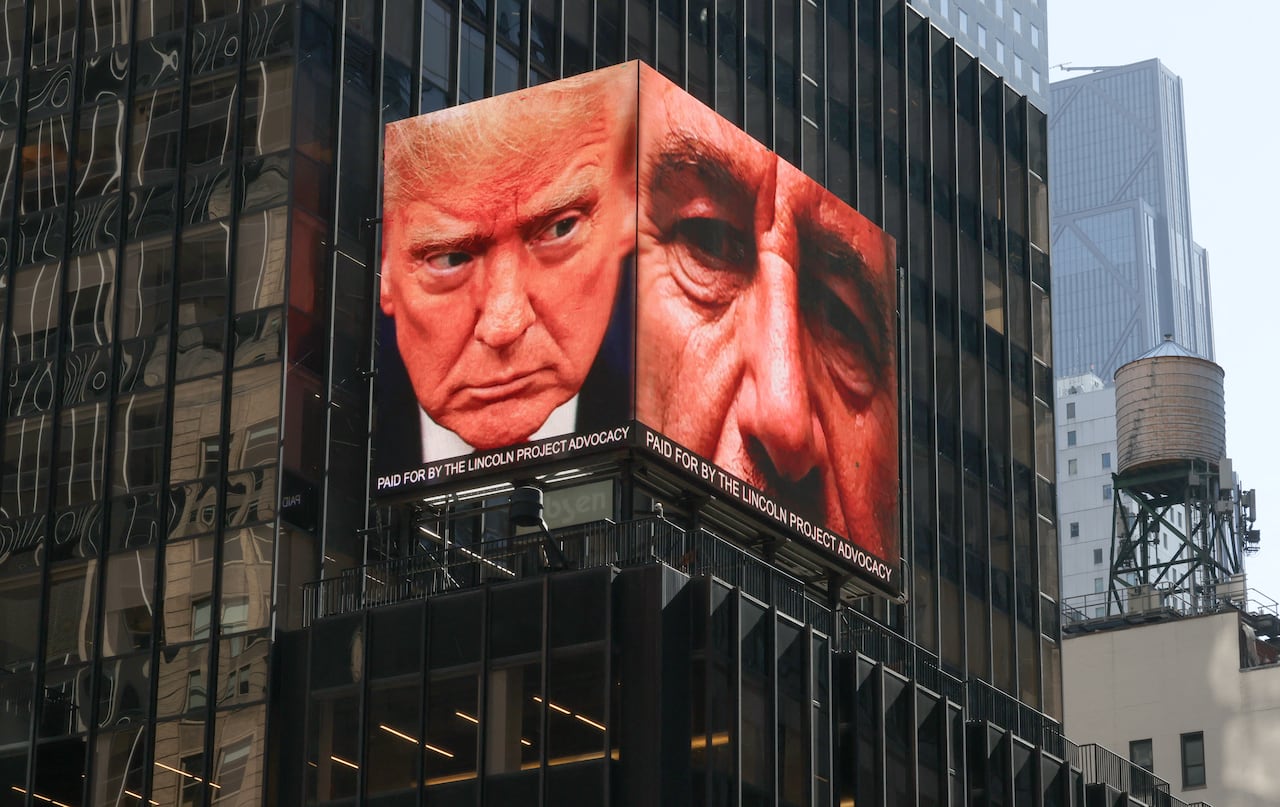 Images of U.S. President Donald Trump and Jeffrey Epstein being displayed on digital billboard in New York City's Times Square