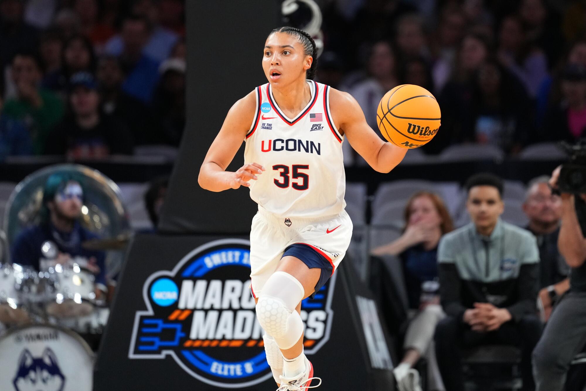 UConn guard Azzi Fudd dribbles up the court during Sweet 16 game against North Carolina on March 27 in Fort Worth, Texas