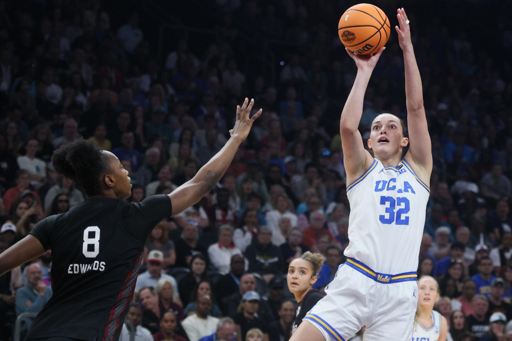 UCLA forward Angela Dugalic shoots over South Carolina forward Joyce Edwards during the NCAA championship.