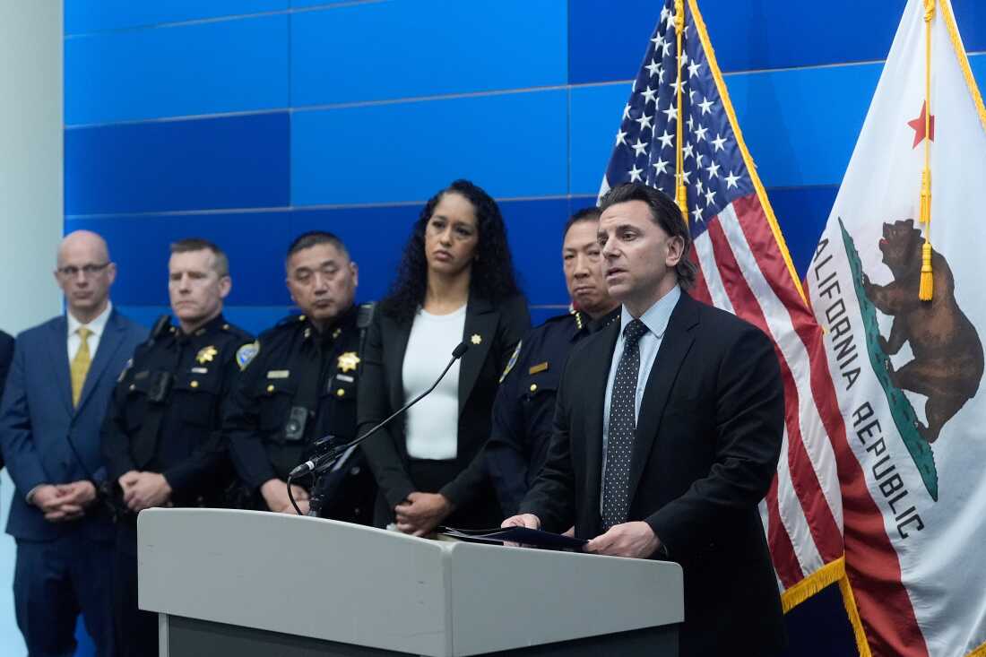 Matt Cobo, F.B.I. San Francisco Acting Special Agent in Charge ( right) speaks next to San Francisco Police Chief Derrick Lew (second from right) and San Francisco District Attorney Brooke Jenkins (third from right) during a news conference Monday, April 13, 2026, in San Francisco. )