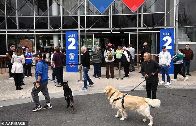 Western Bulldogs supporters wait to enter the ground for a training session as Prince Harry the Duke of Sussex visits with the Movember Foundation at the Western Bulldogs headquarters, Whitten Oval in Melbourne, Wednesday, April 15, 2026. (AAP Image/Joel Carrett) NO ARCHIVING