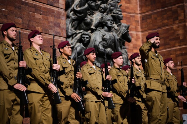 Israeli soldiers rehearse for a ceremony marking the annual Holocaust Remembrance Day at the Yad Vashem Holocaust Memorial in Jerusalem Tuesday, April 14, 2026. (AP Photo/Ohad Zwigenberg)