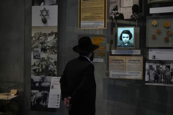 People visit the Yad Vashem Holocaust Memorial Museum in Jerusalem, Tuesday, April 14, 2026, as the annual Israeli memorial day for the 6 million Jews killed in the Holocaust of World War II begins at sundown on Sunday. (AP Photo/Ohad Zwigenberg)