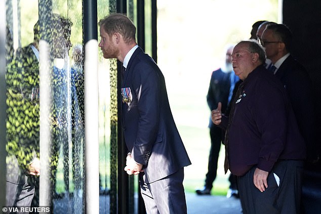 Britain's Prince Harry, the Duke of Sussex views the Australian War Memorial with Indigenous veteran Michael Bell in Campbell, Canberra, on day two of the royal trip to Australia, April 15, 2026.    Jonathan Brady/Pool via REUTERS