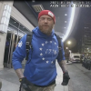 Shane Jenkins, seen here in police bodycam footage from Jan. 6, 2021, was convicted of multiple charges in connection with the Capitol riot, including assaulting police, and was sentenced to seven years in prison. Just months after receiving a pardon from President Trump, Jenkins visited the White House along with another former Jan. 6 defendant.
