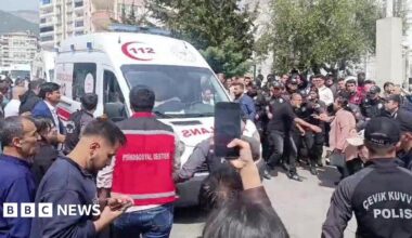 An ambulance leaves the scene following a deadly school shooting, in the southeastern province of Kahramanmaras