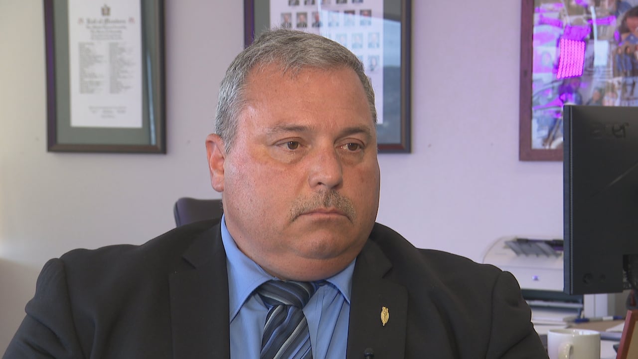 A man sits in a chair