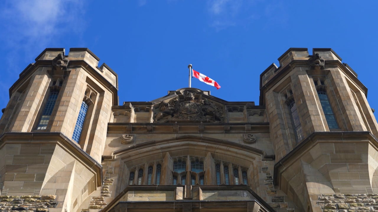 The outside of a building with a Canadian flag
