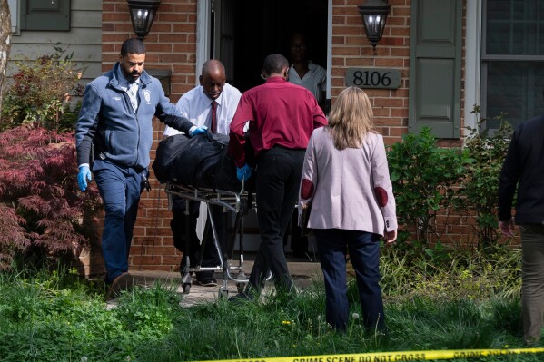 Fairfax County coroners remove a body from the home of former Virginia Lt. Gov. Justin Fairfax, in Annandale, Va., Thursday, April 16, 2026. (AP Photo/Cliff Owen)