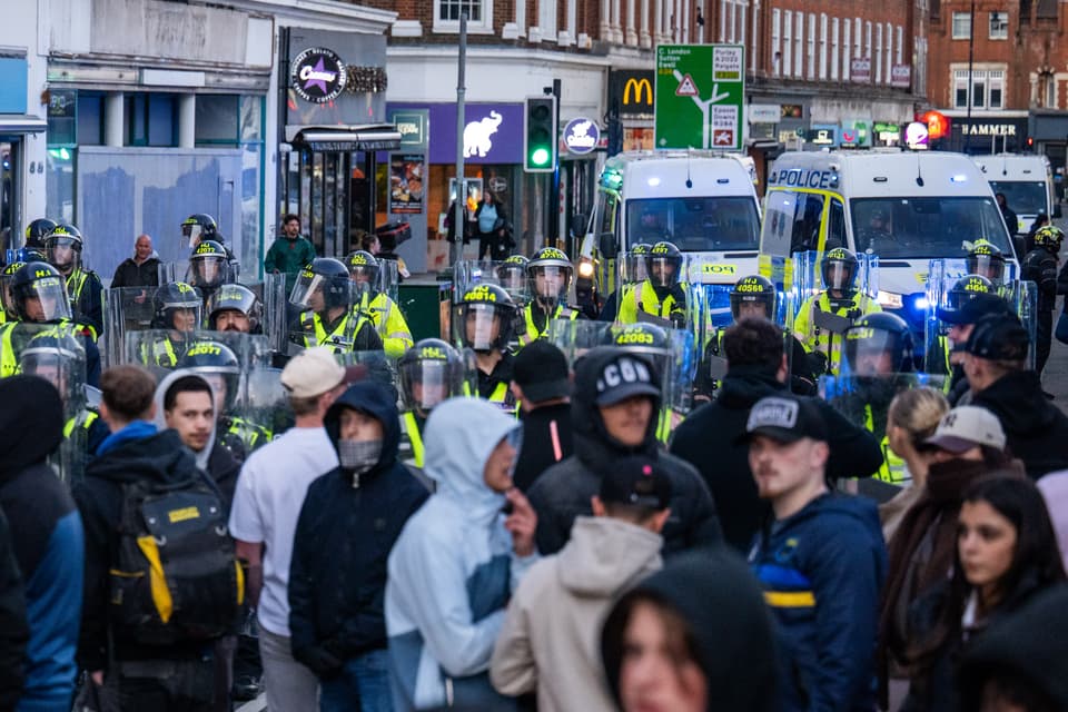 <p>EPSOM, ENGLAND - APRIL 15: Police are seen on Epsom high street as people come out to protest after a woman was raped last Saturday on April 15, 2026 in Epsom, England. Locals have gathered to demonstrate after a woman in her 20's was raped by several men outside a church. The incident reportedly took place after the woman left a nightclub in the early hours of April 11. Police say they have opened an investigation, but so far have not released descriptions of the suspects. (Photo by Ben Montgomery/Getty Images)</p>