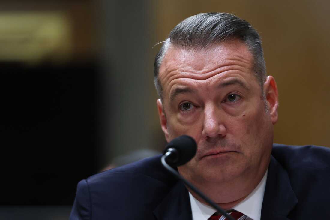 FILE - Todd Lyons, senior official performing the duties of the director at U.S. Immigration and Customs Enforcement, listens during a Senate Homeland Committee hearing on Capitol Hill in Washington, Feb. 12, 2026.