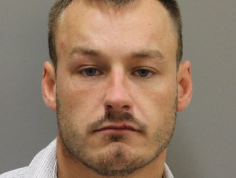 A man with a collared shirt is shown.