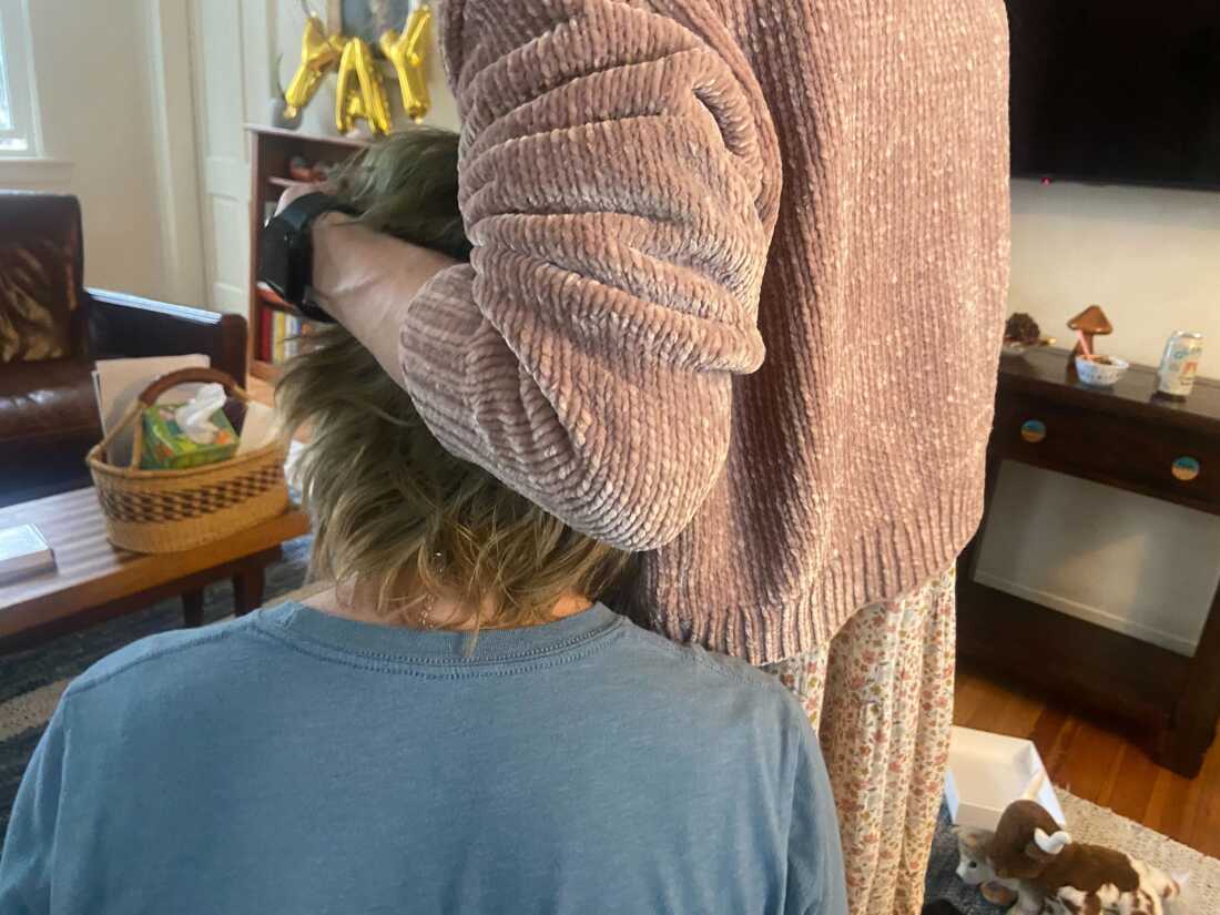 J and her son, nicknamed Bug, share a hug at home in western Massachusetts.