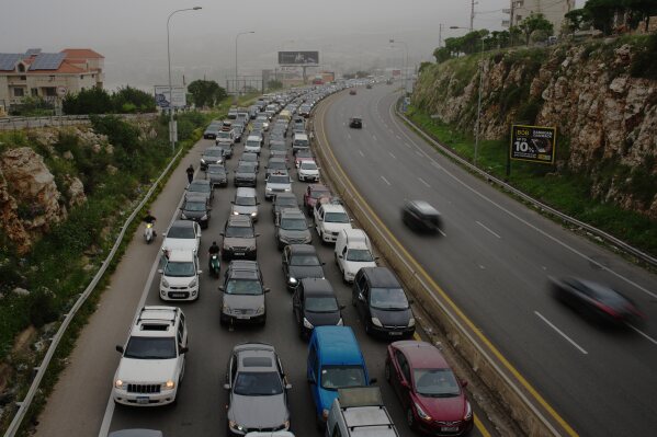 Displaced residents drive back to their villages following a ceasefire between Israel and Hezbollah, in Jiyeh, near Saida, southern Lebanon, Friday, April 17, 2026. (AP Photo/Hassan Ammar)