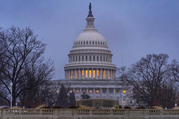 The Capitol is seen during heavy rain as the Department of Homeland Security funding bill remains in limbo, in Washington, Friday, Feb. 20, 2026. (AP Photo/J. Scott Applewhite)
