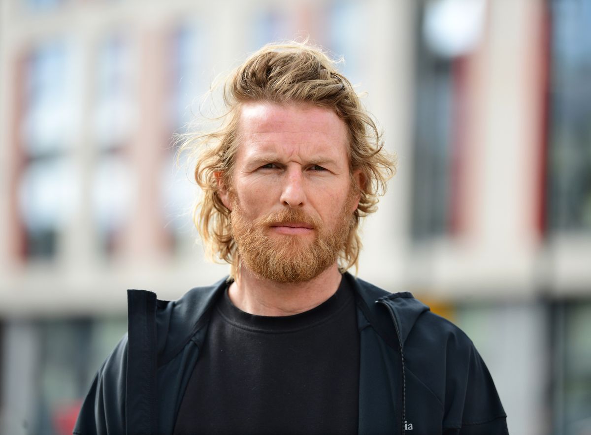 Head and shoulder shot of John Fraser with long sandy hair and a full beard