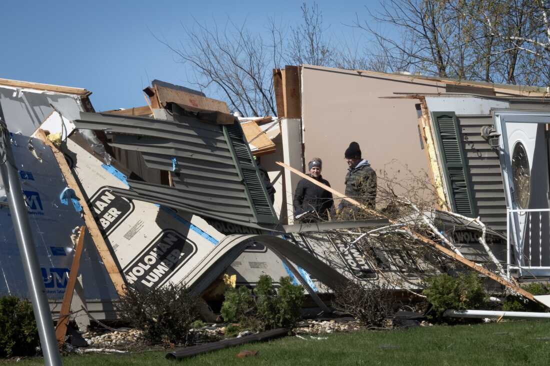 People continue to clean up following tornado on April 18, 2026 in Lena, Illinois.