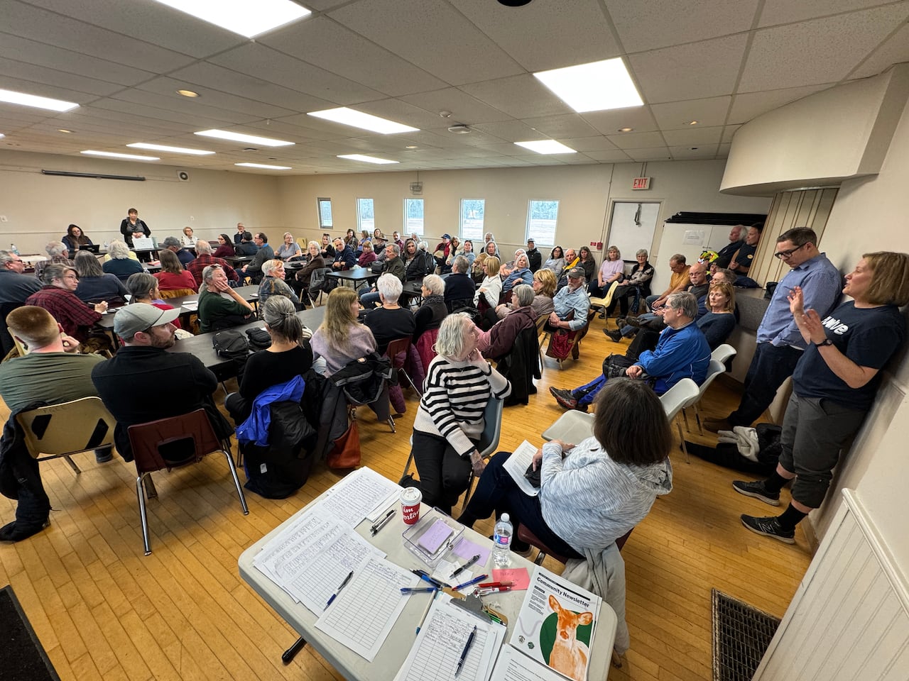 People sitting in a hall