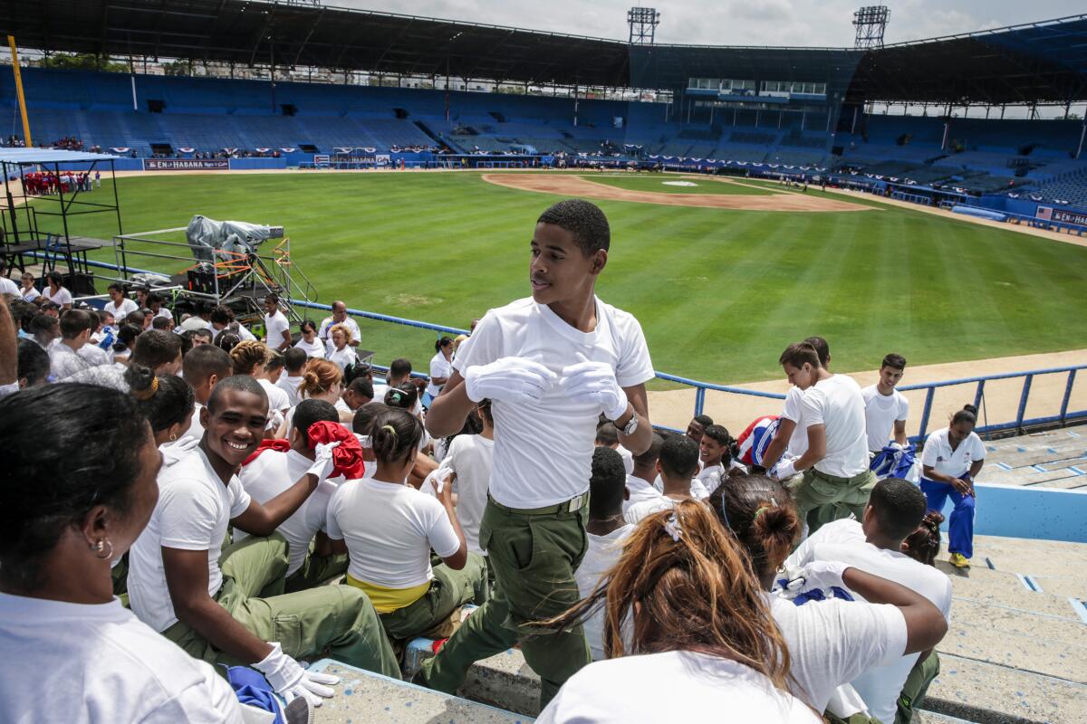 Military school students watch the Cuba National baseball team practice