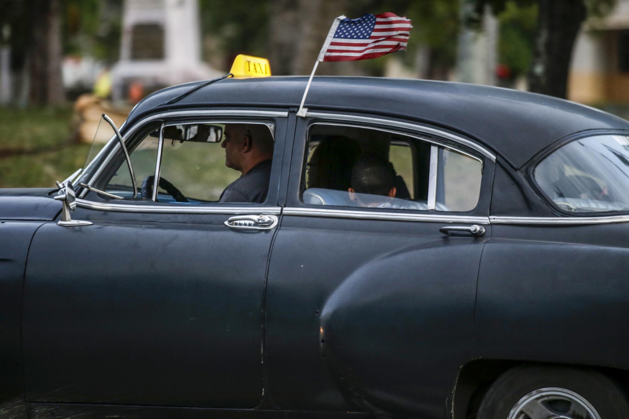 A classic American car on the road in Havana.