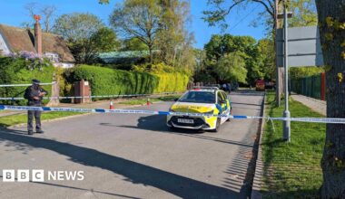 Police officers patrol at a cordon near to an incident at the Kenton United Synagogue in Harrow