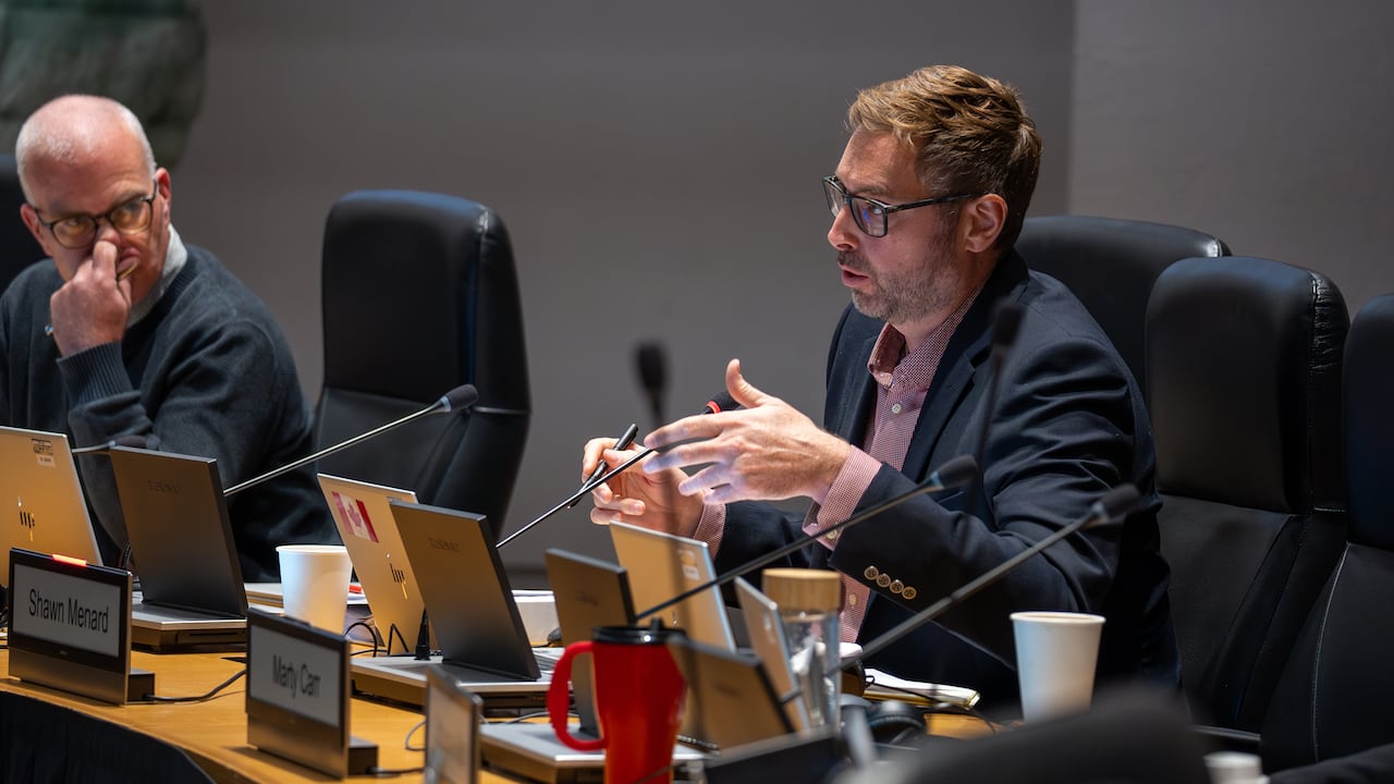 Menard speaks at a council committee meeting in late 2025.