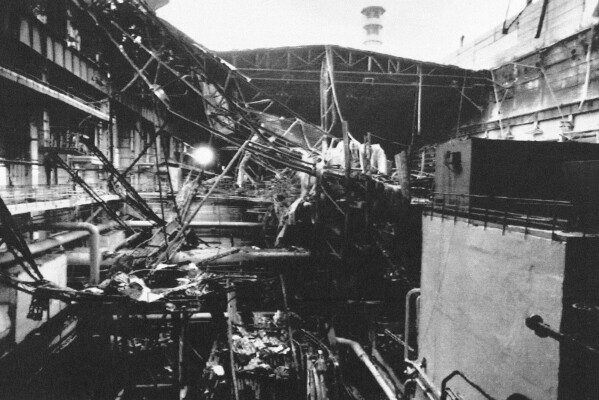 Remains of the collapsed roof at the Chernobyl nuclear plant, damaged in the separate 1991 fire in a turbine hall for Reactor No. 2, in Chernobyl, Ukraine, Oct. 13, 1991. (AP Photo/Efrem Lukatsky, File)