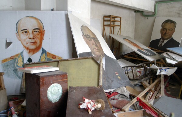 Portraits of Soviet officials covered by radioactive dust sit in a city club in Pripyat, Ukraine, April 10, 2006, where Chernobyl nuclear power plant workers lived and were evacuated after the deadly explosion and fire. (AP Photo/Efrem Lukatsky, File)