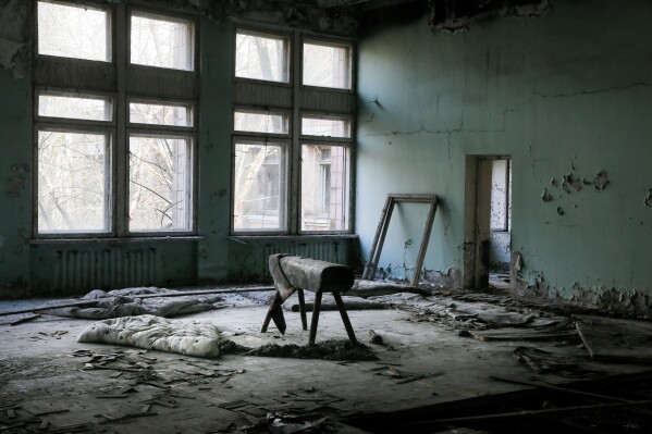 A pommel horse sits in a school gymnasium in the deserted town of Pripyat, Ukraine, April 5, 2017, once home to people whose lives were connected to the nearby Chernobyl nuclear power plant. (AP Photo/Efrem Lukatsky, File)