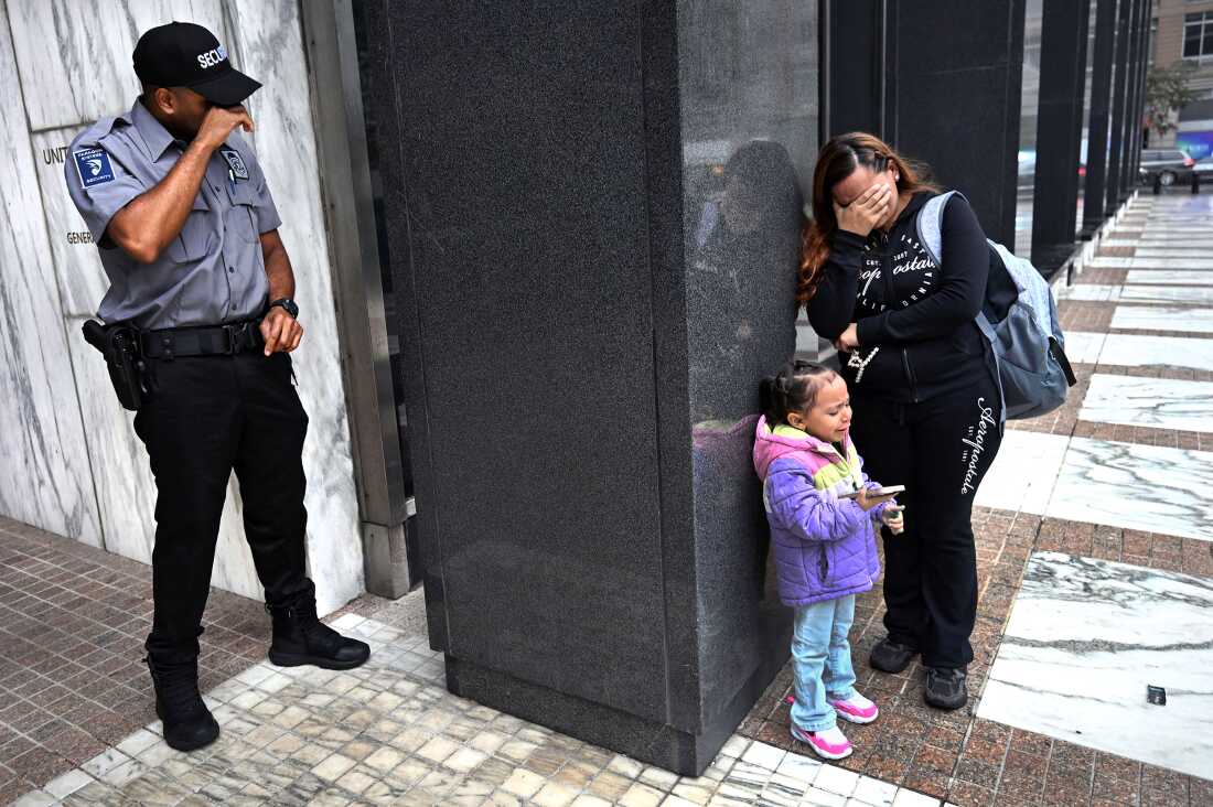 A security guard breaks down while witnessing a family separation. Security personnel frequently find themselves caught between federal agents, desperate families, and protesters in the increasingly volatile courthouse environment in New York City on August 20, 2025.  