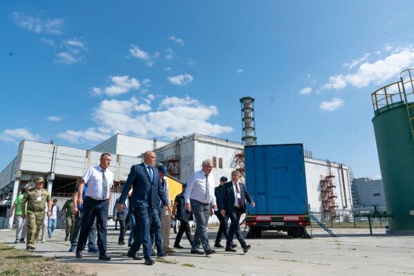 In this photo released by Rosatom State Atomic Energy Corporation, International Atomic Energy Agency Director General Rafael Grossi, center, walks with members of his delegation and employees while visiting the Kursk Nuclear Power Plant outside the town of Kurchatov, Russia, on Aug. 27, 2024. (Rosatom State Atomic Energy Corporation via AP, File)