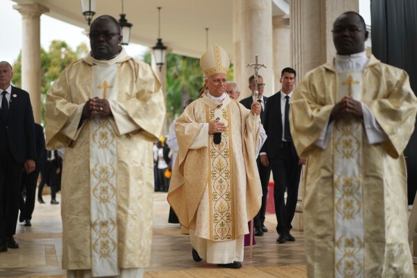 Pope Leo XIV arrives to celebrate the Holy mass at the Basilica of the Immaculate Conception of Mongomo, Equatorial Guinea, Wednesday, April 22, 2026, on the tenth day of his 11-day pastoral visit to Africa. (AP Photo/Andrew Medichini)