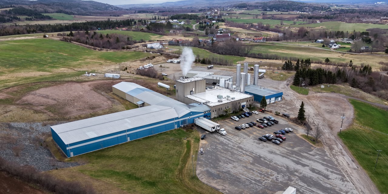 A drone photo of a factory with large land expanses around it