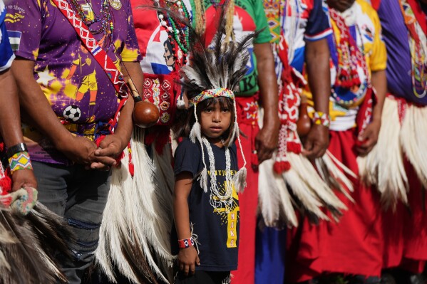 A Maka child takes part in a ceremony on Americas Indigenous Peoples Day on lands they dispute with the government, in Asuncion, Paraguay, Sunday, April 19, 2026. (AP Photo/Jorge Saenz)